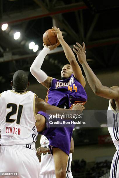 Courtney Sims of the Iowa Energy shoots over Jarvis Gunter of the Erie BayHawks at Tullio Arena on December 11, 2008 in Erie, Pennsylvania. NOTE TO...