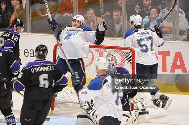 Carlo Colaiacovo of the St. Louis Blues hits the net after scoring in the third period against the Los Angeles Kings during the game on December 11,...