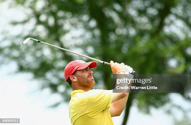 John E Morgan of England plays his chip shot into the 18th green during the second round of the Alfred Dunhill Championship at Leopard Creek Country...