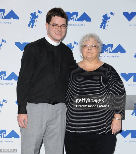 Rev. Robert Wright Lee IV and Susan Bro pose in the press room at the 2017 MTV Video Music Awards at The Forum on August 27, 2017 in Inglewood,...