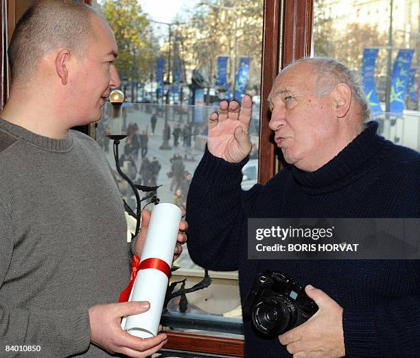 French photographer and film director Raymond Depardon talks with film director Samuel Collardey after they received the Louis-Delluc 2008 award...