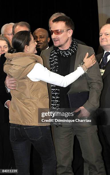 Franco-Colombian politician and former FARC hostage Ingrid Betancourt greets Laureate of the peace summit Award 2008, lead Singer of U2 Bono during...