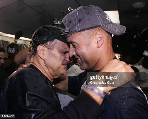 New York Yankees manager Joe Torre and Derek Jeter embrace as they celebrate in the clubhouse after clinching their 9th consecutive American League...