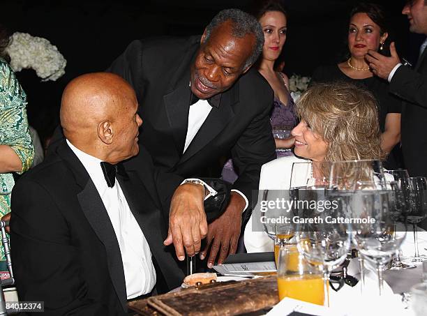 Actor Danny Glover greets Harry Belafonte with his wife Pamela during The 2nd Annual amfAR Cinema Against AIDS Dubai Gala held at the Atlantis, The...