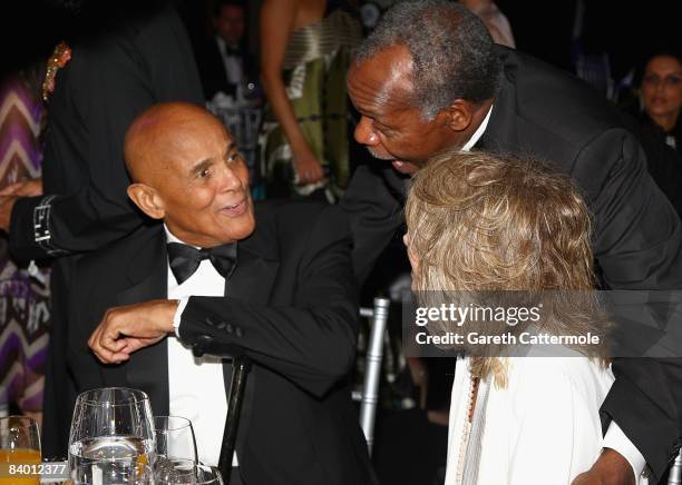 Actor Danny Glover greets Harry Belafonte with his wife Pamela during The 2nd Annual amfAR Cinema Against AIDS Dubai Gala held at the Atlantis, The...