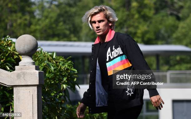 France's forward Antoine Griezmann arrives at the French national football team training base in Clairefontaine on August 28 as part of the team's...