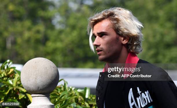 France's forward Antoine Griezmann arrives at the French national football team training base in Clairefontaine on August 28 as part of the team's...