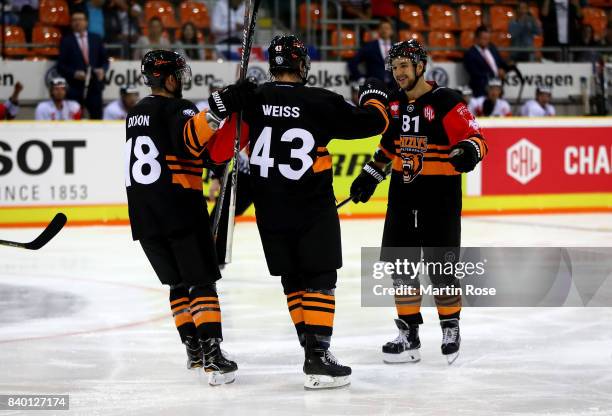 Alexander Weiss of Wolfsburg celebrates after he scores the 4th goal during the Champions Hockey League match between Grizzlys Wolfsburg and HC05...