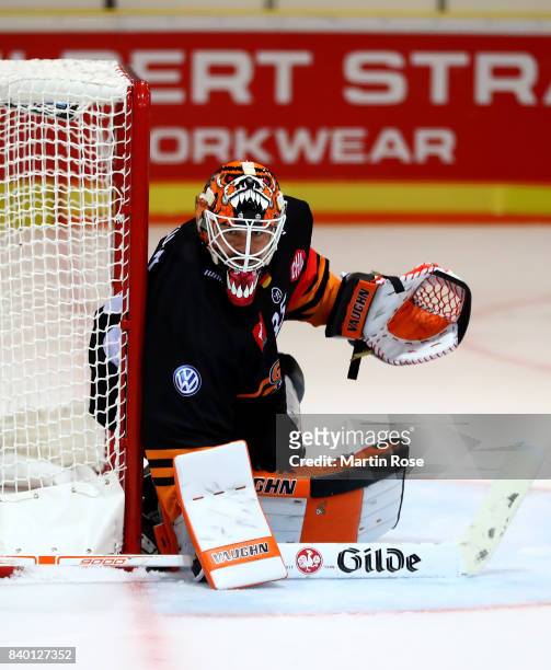 Jerry Kuhn, goaltender of Wolfsburg tends net against Banska Bystrica during the Champions Hockey League match between Grizzlys Wolfsburg and HC05...