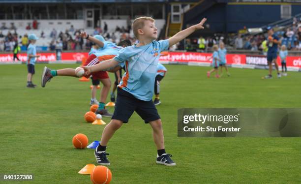 Children participate in ECB All Stars Cricket during the lunch interval during day two of the 2nd Investec Test match between England and West Indies...