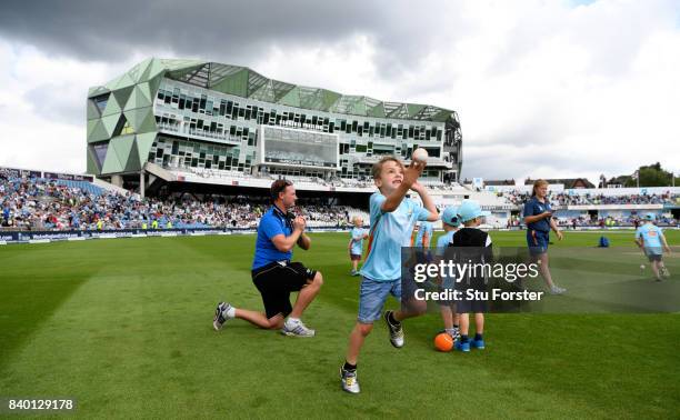 Children participate in ECB All Stars Cricket during the lunch interval during day two of the 2nd Investec Test match between England and West Indies...