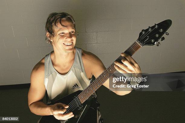 Track & Field: Closeup portrait of javelin thrower Breaux Greer with guitar, Athens, GA 6/7/2005