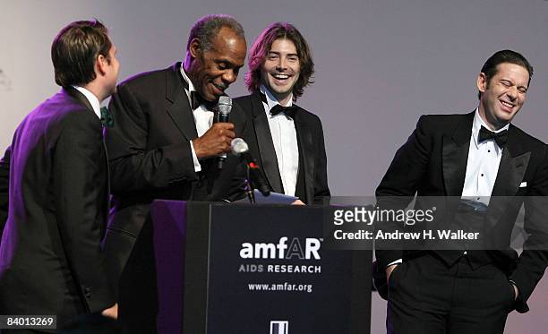 Actor Danny Glover and producers Victor Kubicek and Derek Anderson on stage during The 2nd Annual amfAR Cinema Against AIDS Dubai Gala held at the...