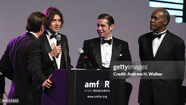 Actor Danny Glover and producers Victor Kubicek and Derek Anderson on stage during The 2nd Annual amfAR Cinema Against AIDS Dubai Gala held at the...