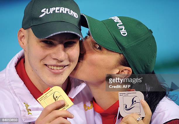 Mirna Jukic of Austria , after she finished second in women�s 200m breaststroke final, kisses her brother Dinko after he won the men�s 400m...