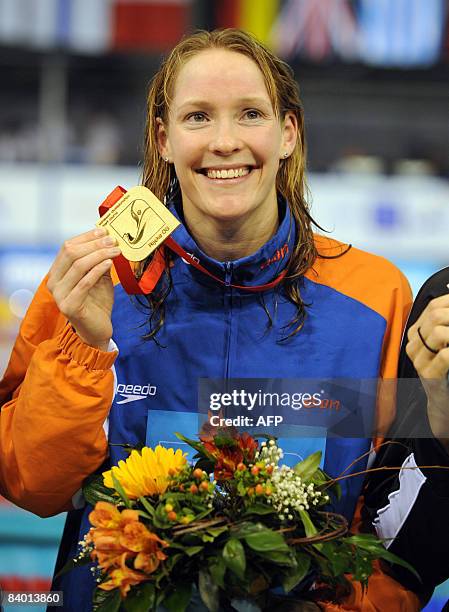 Hinkelien Schreuder of Netherland celebrates her gold medal after winning at women�s final 50m butterfly race, during the European Short Course...