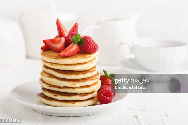 occasions. pancakes with fresh strawberries - stack of plates stock pictures, royalty-free photos & images