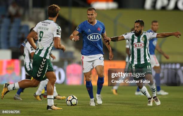 Os Belenenses midfielder Hassan Yebda from Algeria with Vitoria Setubal midfielder Joao Costinha from Portugal in action during the Primeira Liga...