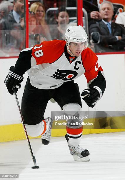 Mike Richards of the Philadelphia Flyers skates with the puck against the Carolina Hurricanes on December 11, 2008 at the Wachovia Center in...