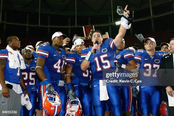 Tim Tebow of the Florida Gators talks to the crowd as they celebrate their 31-20 win over the Alabama Crimson Tide in the SEC Championship on...