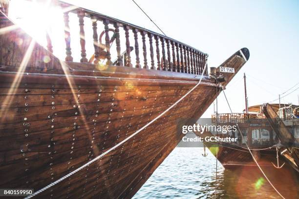 traditional dhow cruise docked at deira creek, dubai - dubai dhow cruise stock pictures, royalty-free photos & images