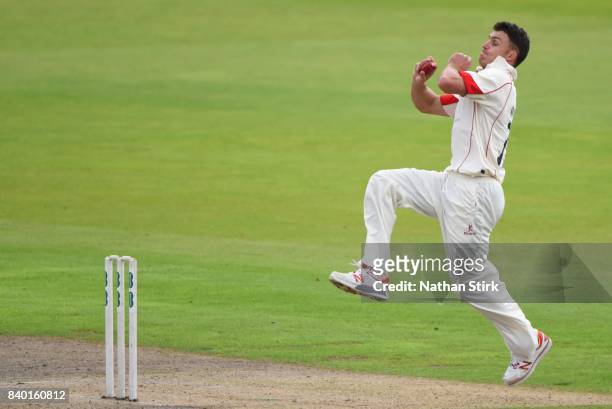 Ryan McLaren of Lancashire runs into bowl during the County Championship Division One match between Lancashire and Warwickshire at Old Trafford on...
