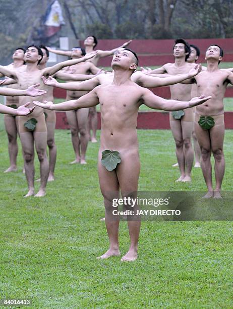 Students and alumni of the country's premier state-run University of the Philippines pose almost naked during the "100 Oblations" in an re-enactement...