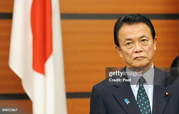 Japanese Prime Minister Taro Aso prior to a photo session with Chinese Premier Wen Jiabao and South Korean President Lee Myung Bak , prior to a...