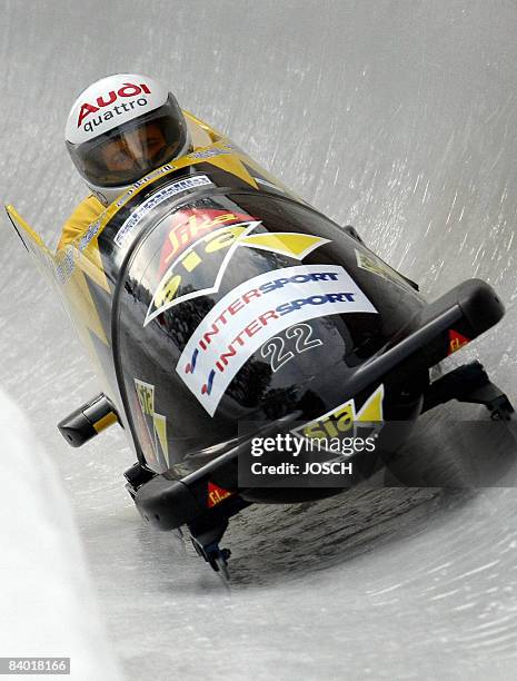 Pilot Hefti Beat and brakeman Thomas Lamparter of Switzerland speed down the ice track in Innsbruck, during the Bobsleigh World Cup competition on...