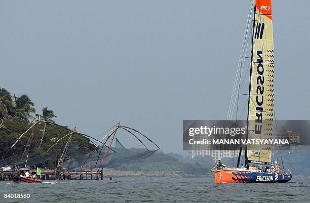 The Ericsson 3 race yacht passes by traditional fishing nets during a ceremonial parade prior to the start of the Volvo Ocean Race third leg to...