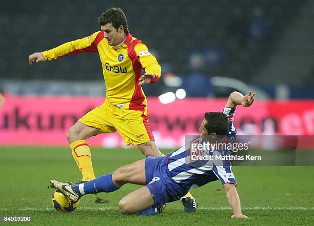 Andreas Goerlitz of Karlsruhe battles for the ball with Pal Dardai of Berlin during the Bundesliga match between Hertha BSC Berlin and Karlsruher SC...