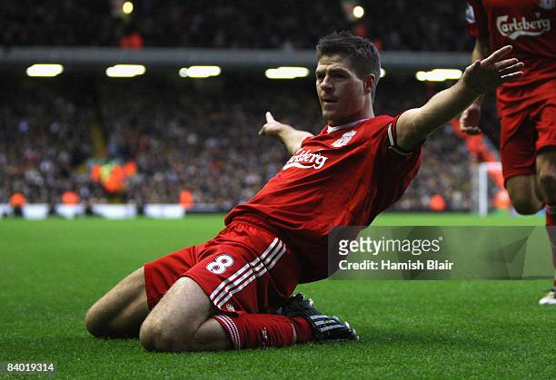 Steven Gerrard of Liverpool celebrates scoring his team's second goal during the Barclays Premier League match between Liverpool and Hull City at...