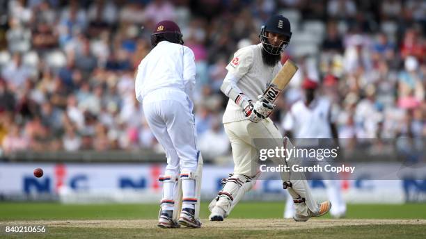 Moeen Ali of England hits past West Indies wicketkeeper Shane Dowrich during day four of the 2nd Investec Test between England and the West Indies at...