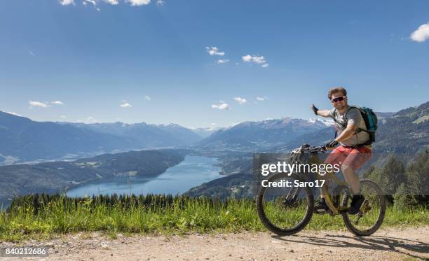 mountainbikers are wellcome to carinthian mountains, austria ! - bad kleinkirchheim stock pictures, royalty-free photos & images