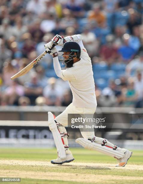 England batsman Moeen Ali drives to the boundary during day four of the 2nd Investec Test Match between England and West Indies at Headingley on...