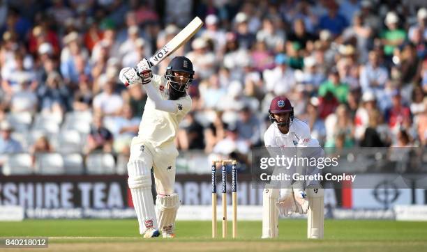 Moeen Ali of England bats watched by West Indies wicketkeeper Shane Dowrich during day four of the 2nd Investec Test between England and the West...