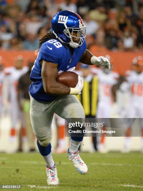 Running back Paul Perkins of the New York Giants carries the ball in the first quarter of a preseason game on April 27, 2017 against the Cleveland...