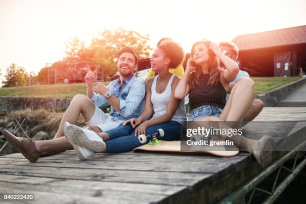 young friends enjoying free time - ipod dock stock pictures, royalty-free photos & images