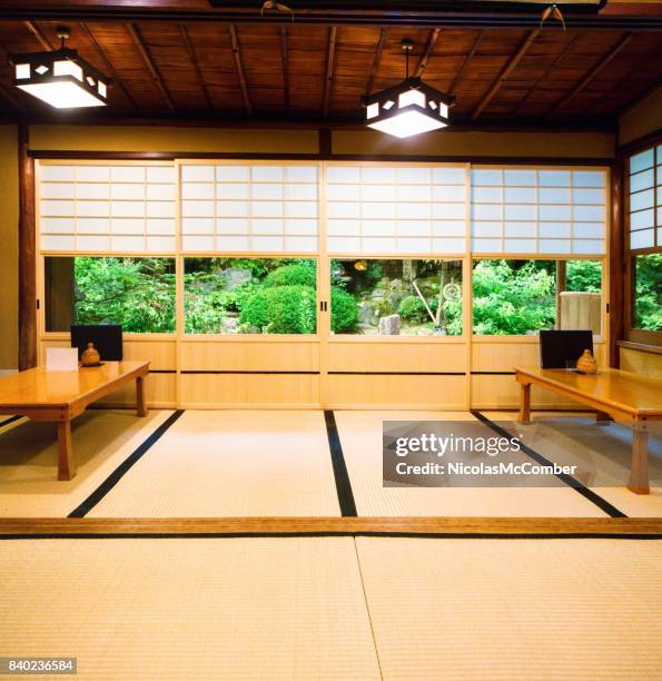 japanese restaurant dining room with sliding doors tatami and garden - tatami mat stock pictures, royalty-free photos & images