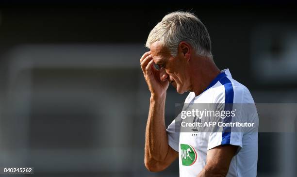 France's head coach Didier Deschamps reacts during a training session in Clairefontaine en Yvelines on August 28 as part of the team's preparation...