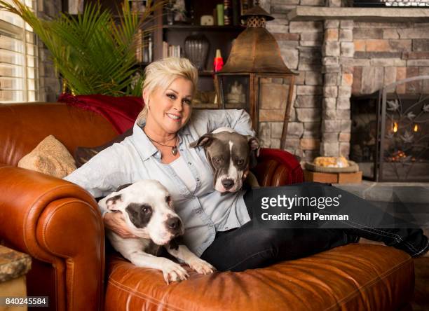 Singer Lorrie Morgan is photographed with her dogs for Closer Weekly Magazine on January 20, 2016 at home in Tennessee.