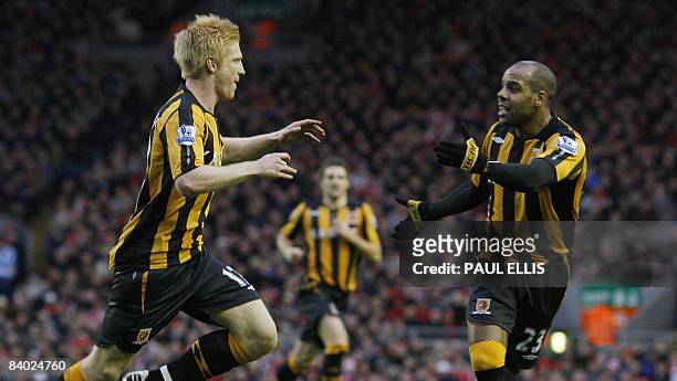 Hull City's Irish defender Paul McShane celebrates scoring the opening goal against Liverpool during their English Premier League football match at...