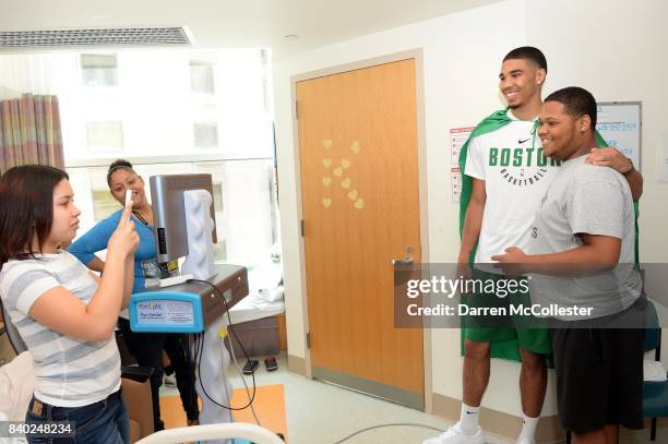 Boston Celtic Jayson Tatum with Boalvi at Boston Children's Hospital August 28, 2017 in Boston, Massachusetts.