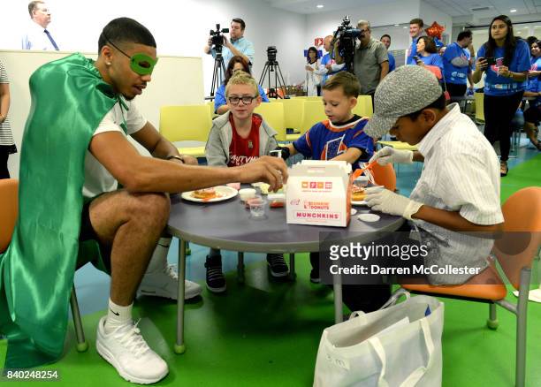 Boston Celtic Jayson Tatum decorates donuts with the kids during Day of Joy Celebration at Boston Children's Hospital August 28, 2017 in Boston,...