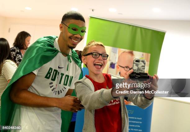 Boston Celtic Jayson Tatum takes a selfie with Matthias at Boston Children's Hospital August 28, 2017 in Boston, Massachusetts.