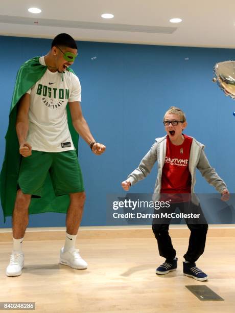 Boston Celtic Jayson Tatum and Matthias show of their superhero poses during Day of Joy Celebration at Boston Children's Hospital August 28, 2017 in...