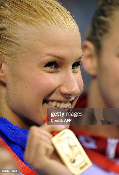 Hanna-Maria Seppaelae of Finland celebrates after winning the women's 1000m individual medley final race, during the European Short Course Swimming...