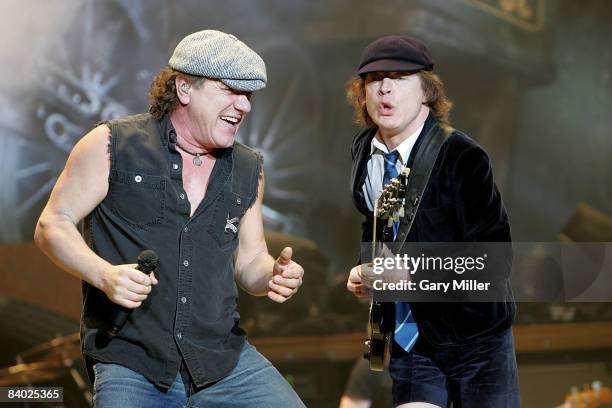 Lead singer Brian Johnson and lead guitarist Angus Young of the Australian band AC/DC perform in concert at the AT&T Center on December 12, 2008 in...