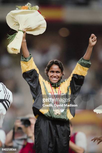Cathy Freeman of Australia celebrates her gold medal in the Women's 400 meter race of the 1999 IAAF World Championships on August 26, 1999 at the...