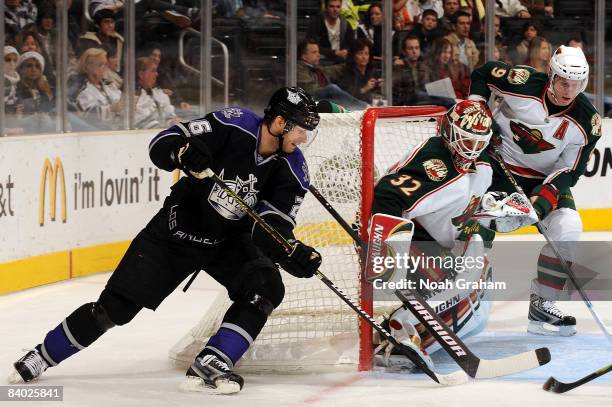 Niklas Backstrom of the Minnesota Wild stops a shot on goal from Michal Handzus of the Los Angeles Kings on December 13, 2008 at Staples Center in...